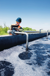 An engineer controlling a quality of water ,aerated activated sludge tank at a waste water treatment plant
water, outdoors, people, man, male, waste, ecology, industry, microbiology, vertical, working, factory, tank, engineer, helmet, quality, pipe, worker, storage tank, one man only, cleaning, caucasian man, water tanks, quality control, sewage treatment, protective clothing, working out, sewage, aeration, mid adult, hard hat, water treatment plant, serious man, wastewater treatment, measuring, writing, water tank, pollution